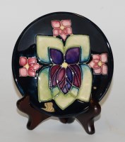 Lot 157 - A Moorcroft pottery pin dish, in the Violet...