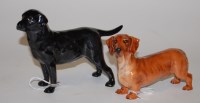 Lot 161 - A Royal Doulton model of a black labrador,...
