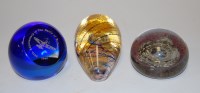 Lot 176 - A glass paperweight with regimental crest for...