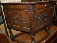 Lot 1219 - A joined and low relief carved oak single door...