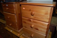 Lot 1243 - A pair of modern pine three drawer bedside chests