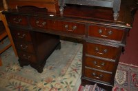 Lot 1286 - A reproduction mahogany and red leather inset...