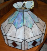 Lot 1307 - A pair of Tiffany style leaded octagonal...