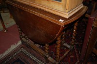 Lot 1339 - An early 20th century oak barleytwist gateleg...