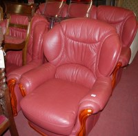 Lot 1359 - A modern walnut framed and red leather...
