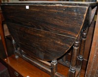 Lot 1422 - A joined and ebonised oak dropleaf dining...