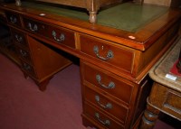 Lot 1432 - A reproduction yew wood and green leather gilt...