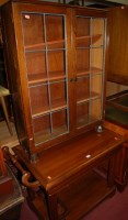 Lot 1433 - A contemporary hardwood two-tier butlers table