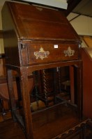 Lot 1436 - An early 20th century oak slopefront single...