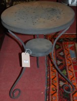 Lot 1437 - An anodised metal circular two-tier bistro...