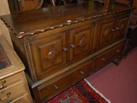 Lot 1438 - An early 20th century moulded oak four door...