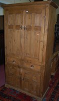 Lot 1441 - A pine freestanding four door side cupboard,...
