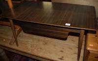 Lot 1446 - A 1950s walnut low work table, having central...