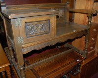 Lot 1453 - A moulded oak telephone seat