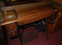 Lot 1454 - An early 20th century Singer treadle sewing...