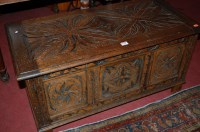 Lot 1455 - An early 20th century low relief carved oak...