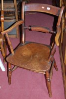 Lot 1381 - An early 20th century elm seat and beech...