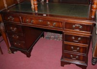 Lot 1392 - A reproduction mahogany and green leather gilt...