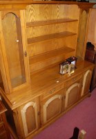 Lot 1399 - A reproduction moulded oak dresser