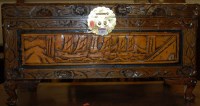 Lot 1400 - A small Eastern low relief carved camphor wood...
