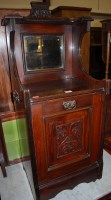 Lot 1408 - An Edwardian walnut mirrorback coal purdonium