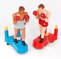 Lot 3182 - 2 plastic hand operated boxers, Made in Singapore