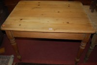 Lot 1223 - A pine round cornered kitchen table, raised on...