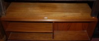 Lot 1364 - A 1960s teak portable low coffee table having...