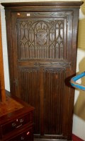 Lot 1085 - A Gothic Revival oak low relief linenfold...