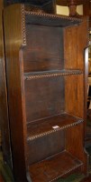 Lot 1188 - A 1920s beaded oak freestanding open bookshelf...