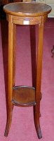 Lot 1189 - An Edwardian mahogany circular two tier plant...