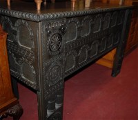 Lot 1200 - A contemporary heavily carved walnut hinge top...