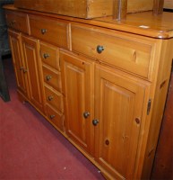 Lot 1203 - A modern pine round cornered sideboard