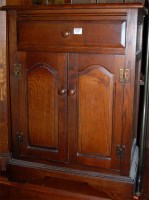 Lot 1207 - A moulded oak double door side cupboard of...