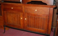 Lot 1208 - A contemporary stained beech and wrought metal...