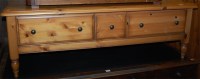 Lot 1210 - A modern pine round cornered three drawer low...