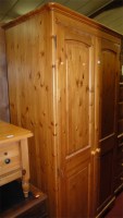 Lot 1212 - A modern pine double door wardrobe, w.100cm