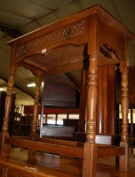 Lot 1214 - A reproduction moulded oak credence shaped...