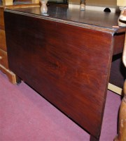 Lot 1220 - A George III mahogany dropleaf dining table