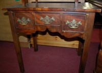 Lot 1237 - A George III mahogany three drawer lowboy