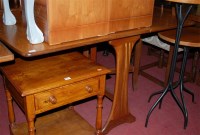 Lot 1271 - A 1970s G-Plan teak dropleaf kitchen table,...