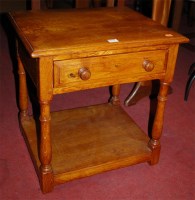 Lot 1272 - A joined and moulded oak low single drawer two...