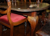 Lot 1280 - An Edwardian walnut extending dining table,...