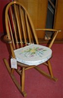 Lot 1285 - An Ercol mid-elm stickback rocking elbow chair
