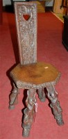 Lot 1297 - A Far Eastern influenced low relief carved oak...