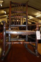 Lot 1299 - A 19th century elm and rush seat spindleback...