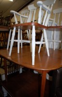 Lot 1311 - A 1970s teak extending dining table, having...