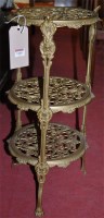 Lot 1318 - A cast pierced brass circular three tier...