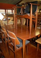 Lot 1326 - A 1960s teak dining suite, comprising...