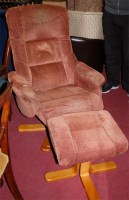 Lot 1339 - A contemporary upholstered swivel armchair...